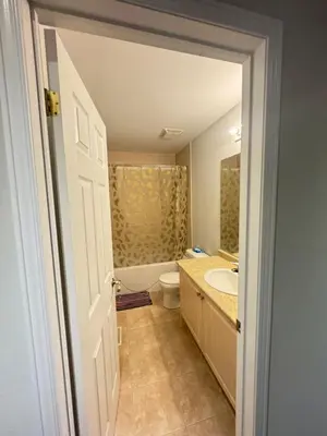 a bathroom with a tub and a toilet and a sink at Gorgeous Private room in Toronto