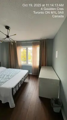 a bedroom with two beds and a window at Gorgeous Private room in Toronto