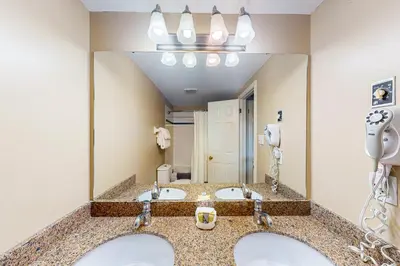 a bathroom with two sinks and a large mirror at Condo 701 at North Creek Resort in Blue Mountains