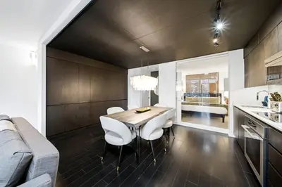a kitchen and dining room with a table and chairs at Luxury 4BR Home Sleeps 14 with Parking in Toronto