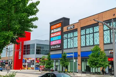 a building with many signs on the side of it at Spacious 3-BDR Home with Incredible View with parking in Toronto