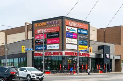 a building with many signs on the side of a street at Spacious 3-BDR Home with Incredible View with parking in Toronto