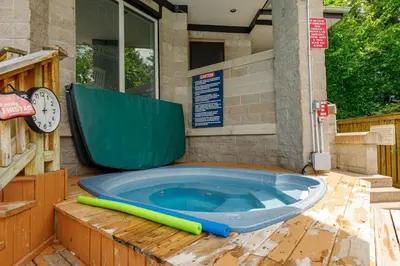 a large hot tub sitting outside of a building at 109 North Creek in Blue Mountains