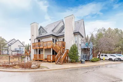 a large house with a porch and a deck at 109 North Creek in Blue Mountains