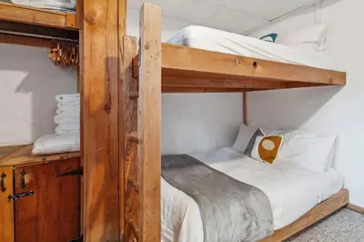a couple of bunk beds in a room at 8 Bedroom Blue Mountain Chalet with Ping-Pong - 218 Arlberg in Blue Mountains
