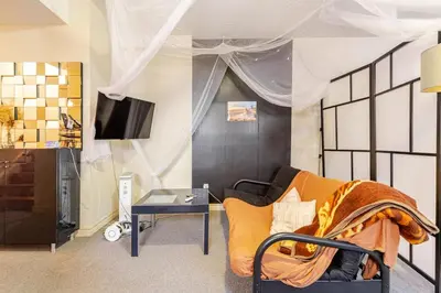 a living room with a couch and a table at Studio Apartment in Casa, semi-bsmt in Toronto
