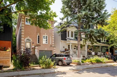 a car parked in front of a house at Studio Apartment in Casa, semi-bsmt in Toronto