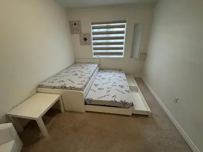 a small bedroom with a bed and a window at Fully furnished 3BR, 3WR entire two storey with unfinished basement- Ford Milton , ON Canada in Milton
