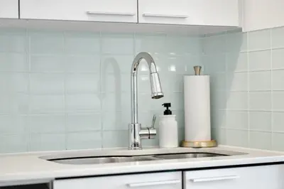 a kitchen counter with a sink and a sink at Tranquil Lakeside Suite Toronto in Toronto