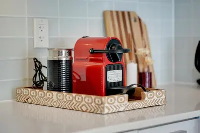 a red appliance sitting on a counter top at Tranquil Lakeside Suite Toronto in Toronto