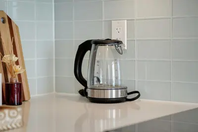 a tea kettle on a counter in a kitchen at Tranquil Lakeside Suite Toronto in Toronto