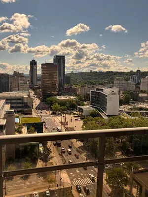 a view of a city with buildings and a street at One-Bedroom Apartment with Den With Amazing Views of Hamilton in Hamilton