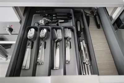a drawer full of utensils in a kitchen at Stylish 2BR Retreat Parking & Sleeps 6 in Toronto