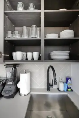 a kitchen counter with a sink and a blender at Modern 3BR Condo Sleeps 8 with Floor-to-Ceiling Views in Toronto