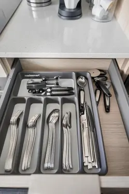 a kitchen stove with utensils in a drawer at Cozy 2BR Condo with Free Parking & City Views in Toronto