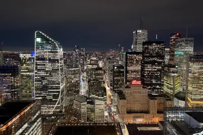 a night view of a large city at night at 60th Floor Luxury SkySuite 3BD Lake & City Views in Toronto