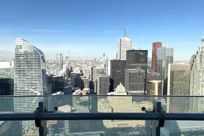 a view of the city from the top of a skyscraper at 60th Floor Luxury SkySuite 3BD Lake & City Views in Toronto