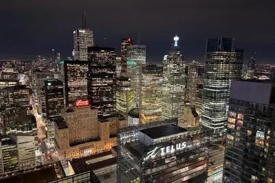 a view of a large city at night at 60th Floor Luxury SkySuite 3BD Lake & City Views in Toronto