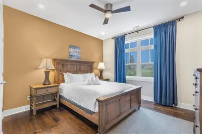 a bedroom with a bed and a window at The Sweet Spot - Walk to Village & Hot Tub in Blue Mountains