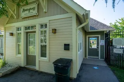 a building with a trash can in front of it at The Sweet Spot - Walk to Village & Hot Tub in Blue Mountains