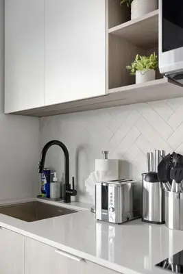 a kitchen with a sink and a counter top with a sink at Skyline Studio with Stunning City Views & Parking in Toronto