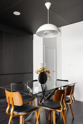 a dining room with a glass table and chairs at Modern 4BR Home Sleeps 12 Steps to CN Tower in Toronto
