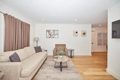 a living room with a couch and a table at RIVERSIDE WALK in Niagara Falls