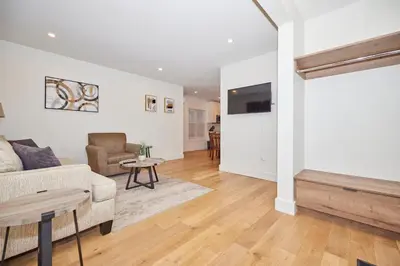a living room with a couch and a table at RIVERSIDE WALK in Niagara Falls