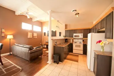 a kitchen and living room with a couch and a refrigerator at SUPERIOR 2 in Niagara Falls
