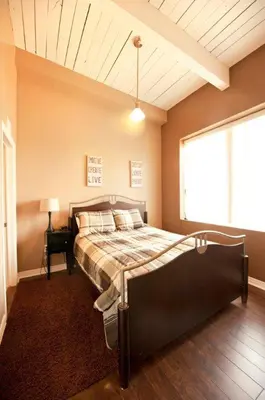 a bedroom with a bed in a room with a window at SUPERIOR 2 in Niagara Falls