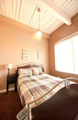 a bedroom with a bed and a window at SUPERIOR 2 in Niagara Falls