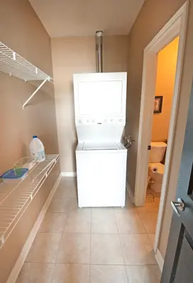 a white refrigerator in a walk in closet at SUPERIOR 3 in Niagara Falls