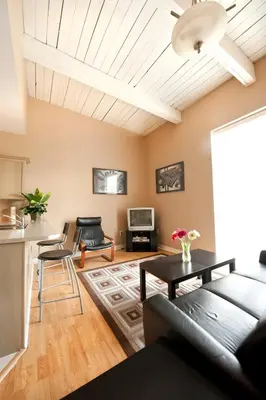 a living room with a couch and a table at SUPERIOR 3 in Niagara Falls