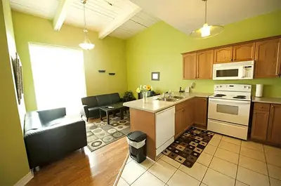 a kitchen with a sink and a stove top oven at Superior 4 in Niagara Falls