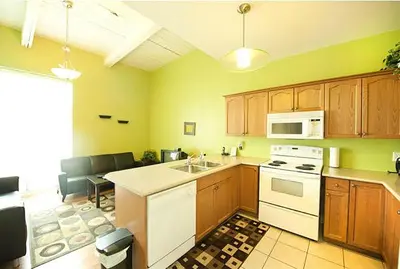 a kitchen with a sink and a stove top oven at Superior 4 in Niagara Falls