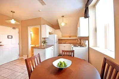 a kitchen with a table with a bowl of fruit on it at Superior 5 in Niagara Falls