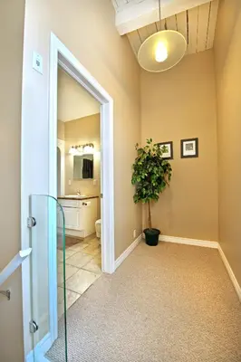 a hallway with a door and a potted plant at Superior 5 in Niagara Falls