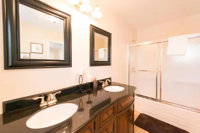 a bathroom with two sinks and a shower at WALK TO THE BEACH in Fort Erie