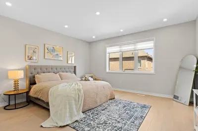 a bedroom with a bed and a window at 6BR Luxe Family Home,Safari Area, Entertainment in Milton