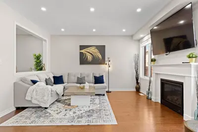 a living room with a couch and a fireplace at 6BR Luxe Family Home,Safari Area, Entertainment in Milton