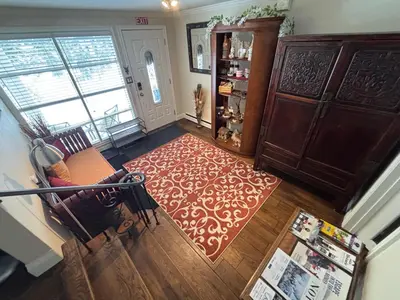 an aerial view of a living room with a red rug at Vintage Pines Guest House in Niagara on the Lake