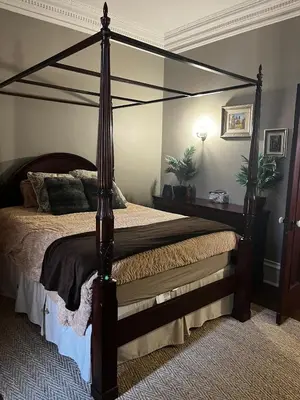 a bedroom with a canopy bed in a room at 1Br Apt In Mansion With Indoor Pool Hot Tub in Hamilton