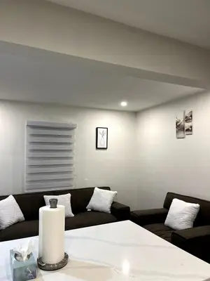 a living room with a couch and a table at Cozy 2-Bed with Kitchen and Patio in Midtown Toronto in Toronto