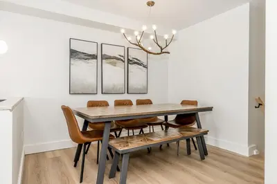 a dining room with a table and chairs at Lift Side Luxury Newly renovated walk to village in Blue Mountains