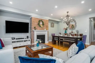 a living room with a couch and a piano at Large 4 Br - 5 Bathroom with Heated Pool 2 King beds Sauna Pool Table in Blue Mountains