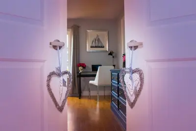 two hearts hanging on a wall in a room at Large 4 Br - 5 Bathroom with Heated Pool 2 King beds Sauna Pool Table in Blue Mountains