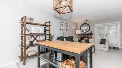 a living room with a table and a couch at Alpine Cove - Condo in Collingwood - Sleeps 6 in Collingwood
