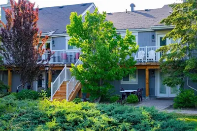 a house with a porch and stairs to the front yard at Cranberry Apres Nest Bright Reno Near Blue Mtn in Collingwood