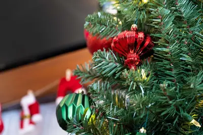 a christmas tree with red ornaments on it at South Wind - Modern Condo in Collingwood - Sleep 5 in Collingwood