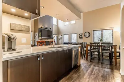 a large kitchen with a sink and a dining room at Mountain Walk Retreat - Walk to Blue Patio area in Blue Mountains